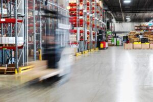 Warehouse material handling with forklift transporting goods in San Francisco & Sacramento
